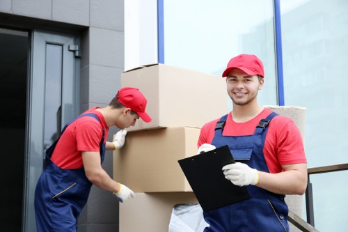 Staff following safe storage procedures in a warehouse environment