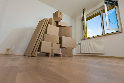 Removal team handling furniture during a South Hornchurch flat move